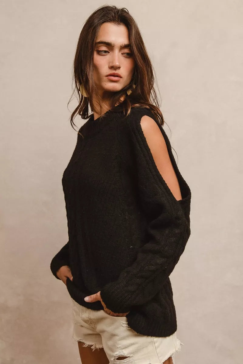 Close side angle of BiBi twist knitted open shoulder sweater highlighting twist knit
