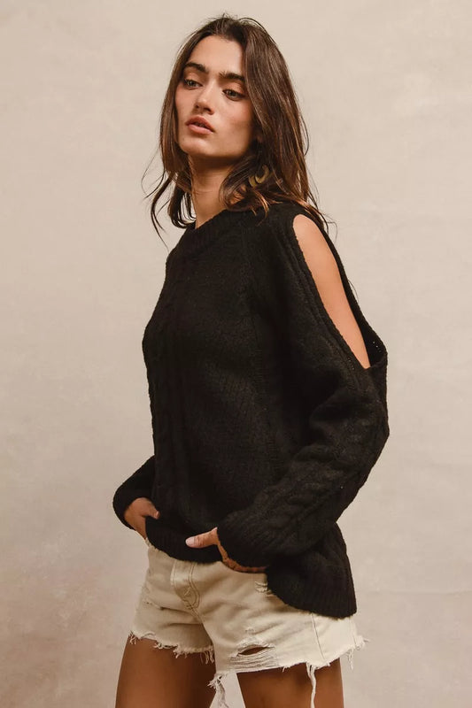 Side view of BiBi twist knitted open shoulder sweater showing open shoulder detail