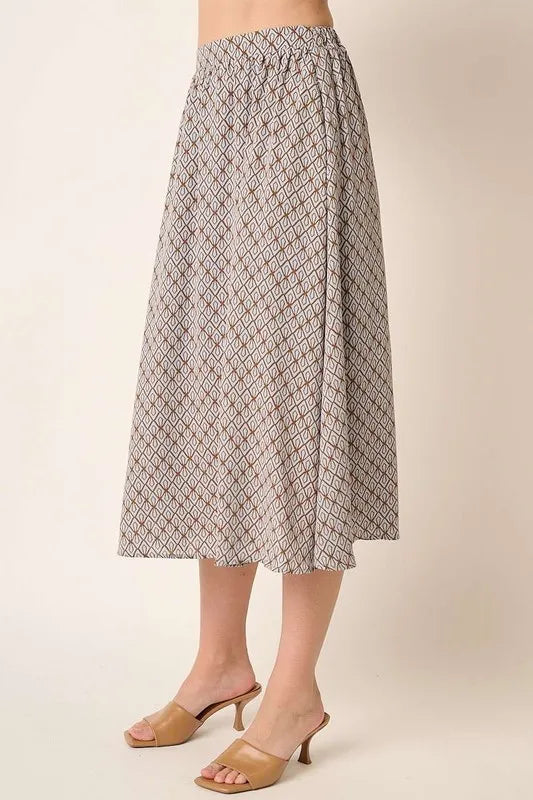Side view of Mittoshop printed midi skirt showing flowy silhouette and elegant midi length