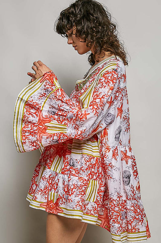 Side view of tiered floral striped dress with pintuck detailing at bodice and ruffle cuffs showing relaxed fit and lightweight breathable fabric