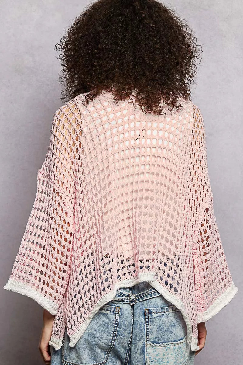 Back view of POL open front openwork cardigan with contrast trim on model