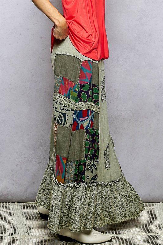 Side view of flowy patchwork skirt showing reverse ruffle detailing and lace accents on a soft rayon maxi skirt.