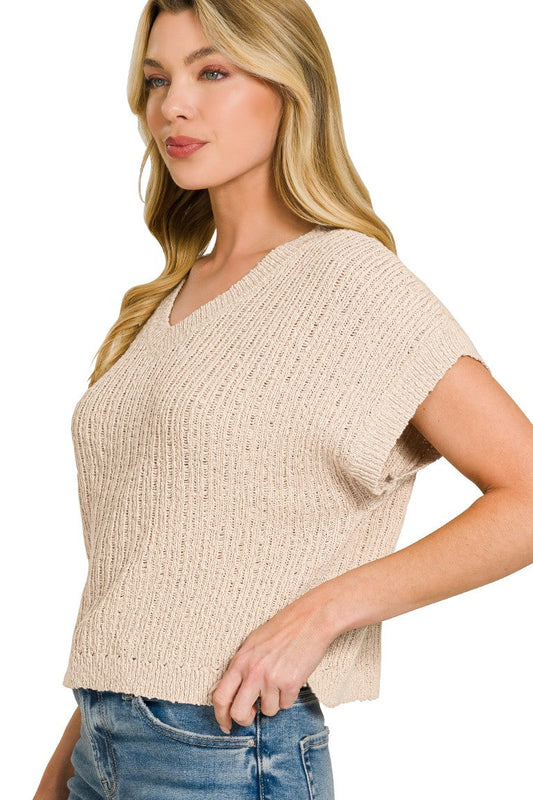 Side view of textured knit cropped sweater showing relaxed silhouette and cropped length