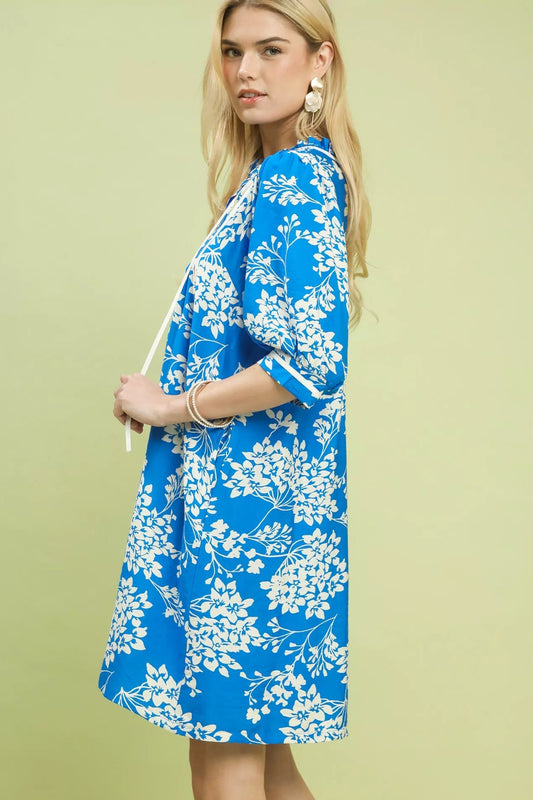 Side view of Umgee floral babydoll dress with pockets showing flowy silhouette