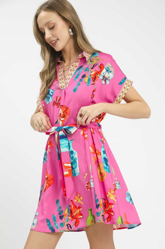 Side profile of Umgee floral print mini dress with belt highlighting fit, flare, and comfortable boutique design.