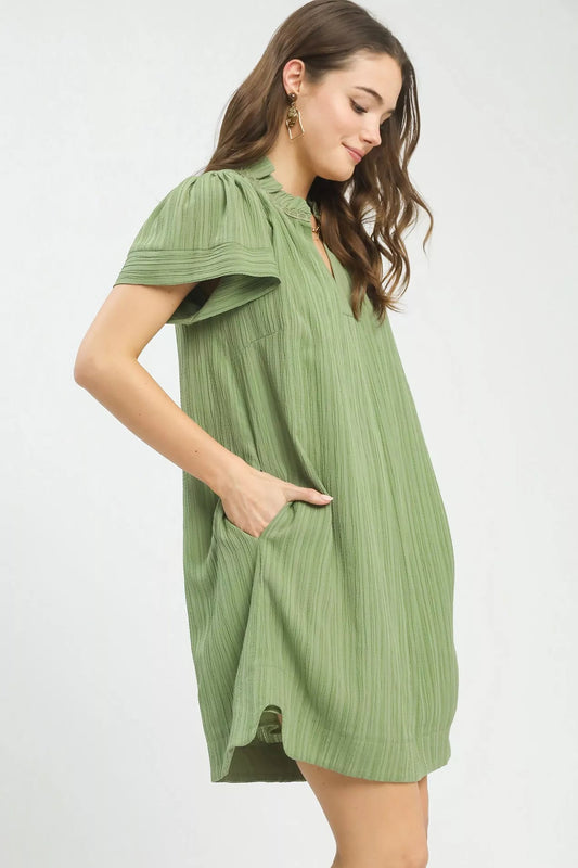 Side view of Umgee flutter sleeve V-neck shift dress showing drape and sleeve detail