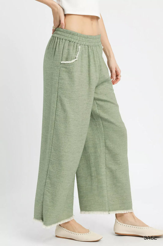Side view of Umgee frayed hem wide leg pants highlighting wide leg fit