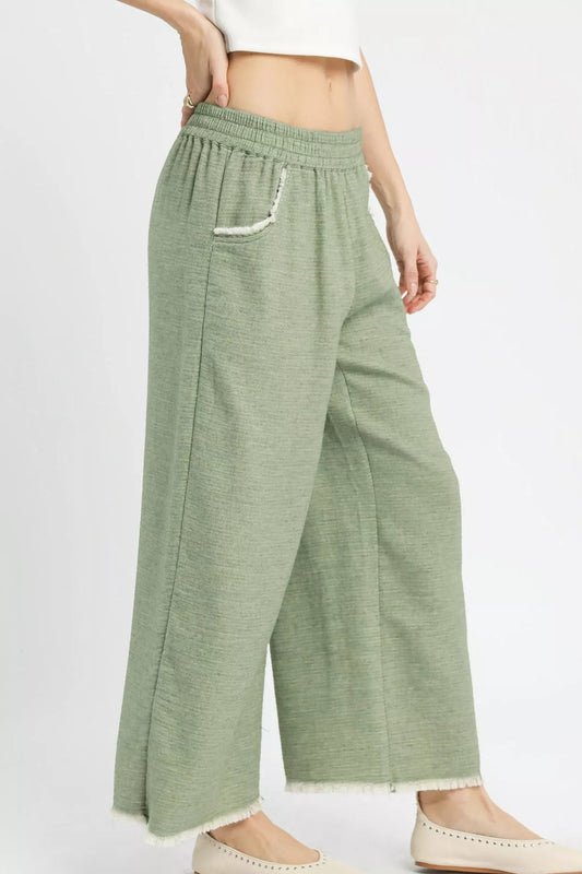 Side view of Umgee frayed hem wide leg pants highlighting wide leg fit
