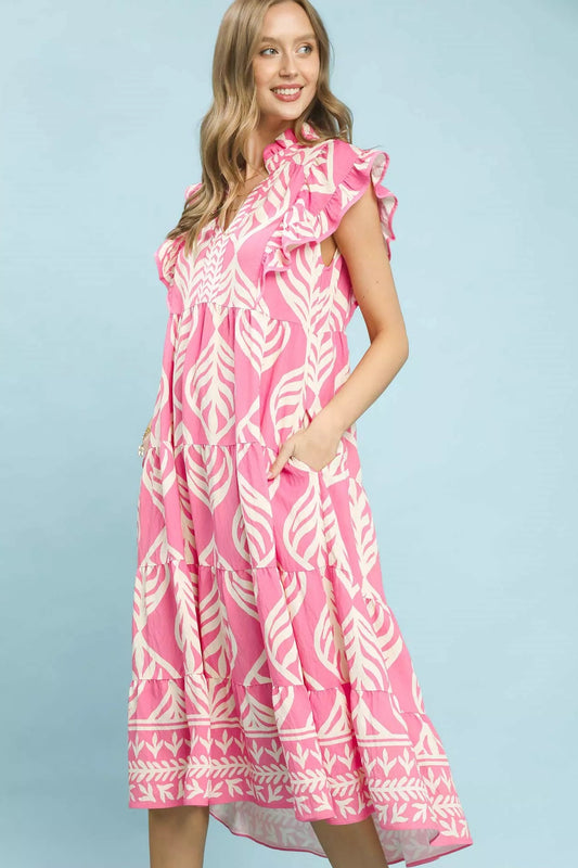 Side view of Umgee Leaf Print Tiered Maxi Dress with Pockets highlighting flowy silhouette and comfortable fit