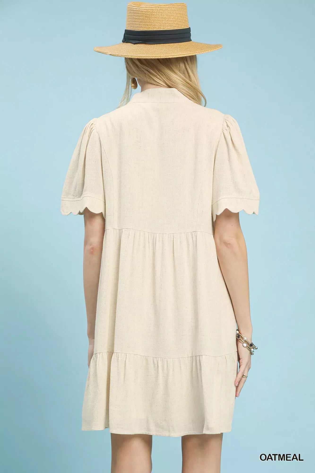 Back view of Umgee linen tiered babydoll dress with scalloped sleeves showing tiered design
