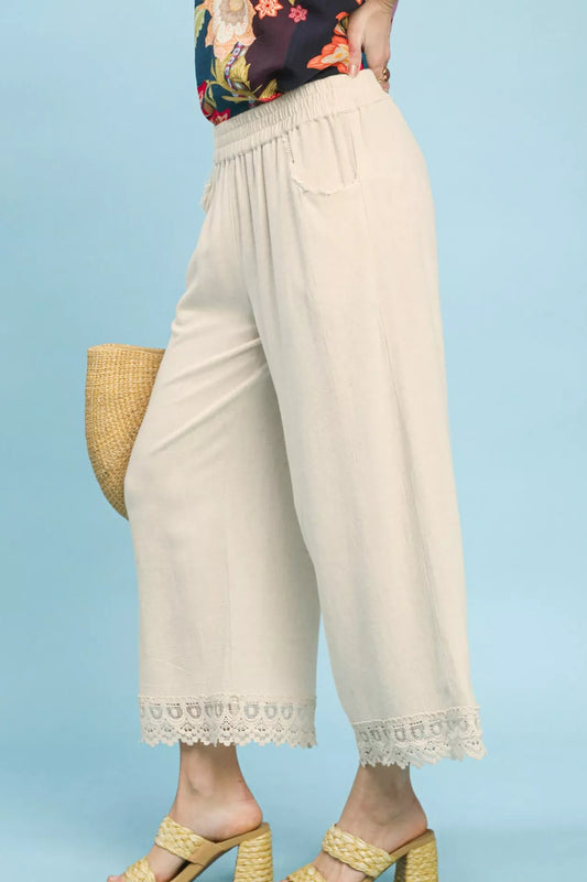 Side view of Umgee linen wide leg cropped pants with lace trim showing cropped length and flowy wide leg silhouette