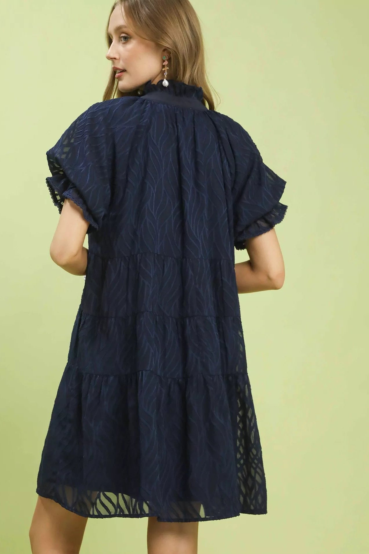 Back view of Umgee textured tiered ruffle collar mini dress showing flowing silhouette and lightweight fabric