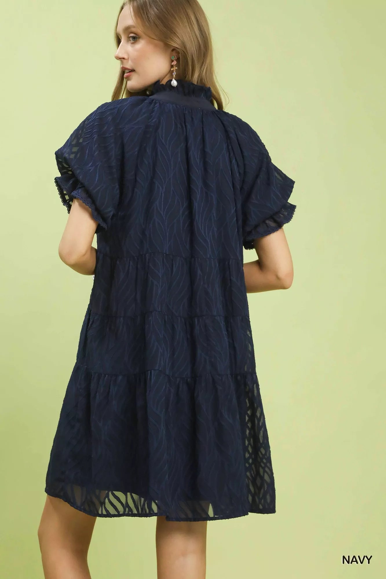 Back view of Umgee textured tiered ruffle collar mini dress showing flowing silhouette and lightweight fabric