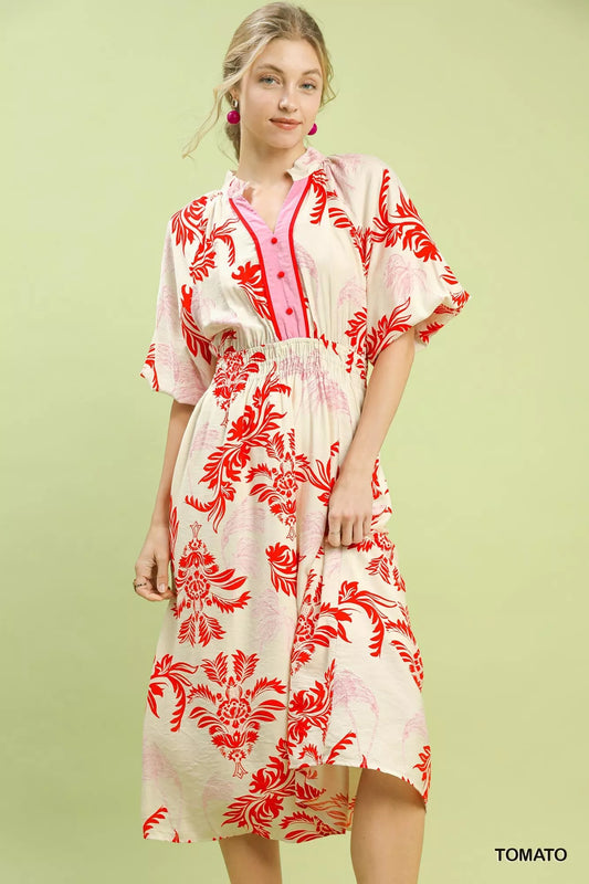 Front detail of Umgee tropical print midi dress highlighting buttons and lightweight fabric
