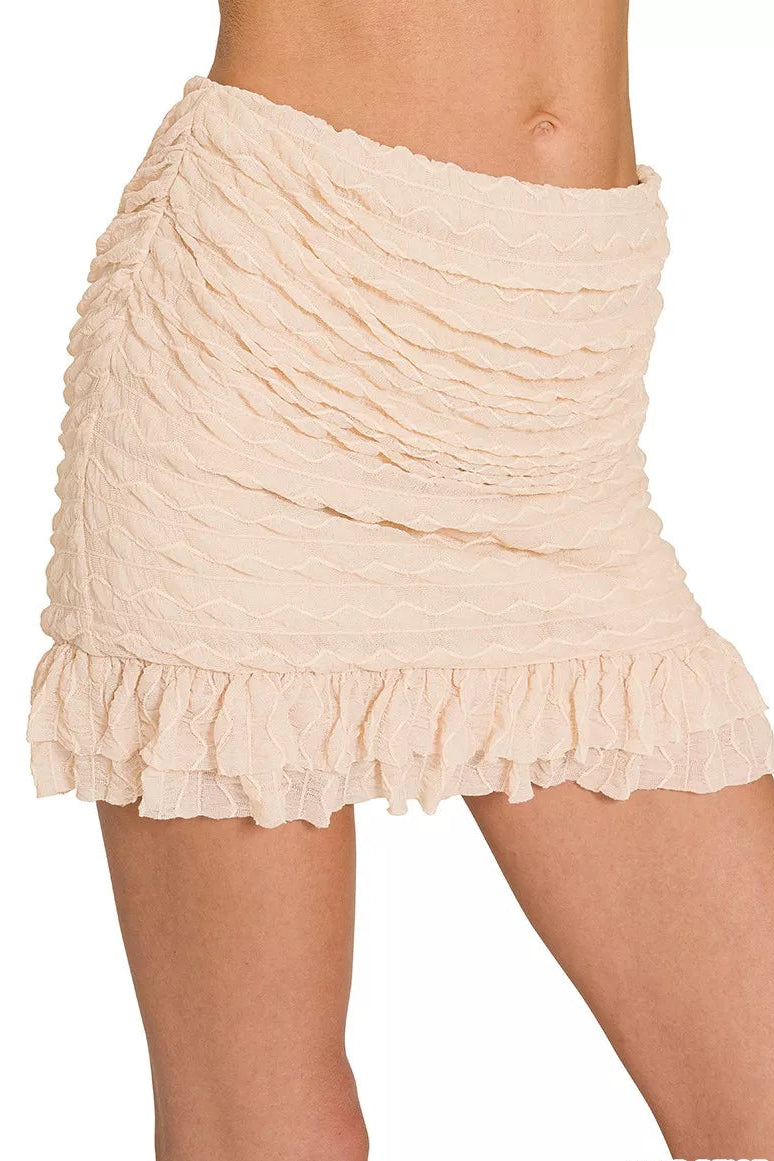 Full front view of Zenana Ruched Mini Skirt with built-in shorts featuring chic mini length and supportive inner shorts.