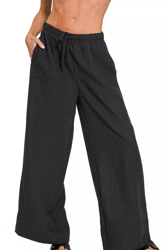Model wearing Zenana Woven Airflow Drawstring Pants showcasing adjustable waist and flowy lightweight design