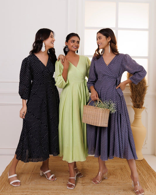 Three women wearing trendy midi dresses with polka dot and wrap styles, styled for everyday wear and confidence