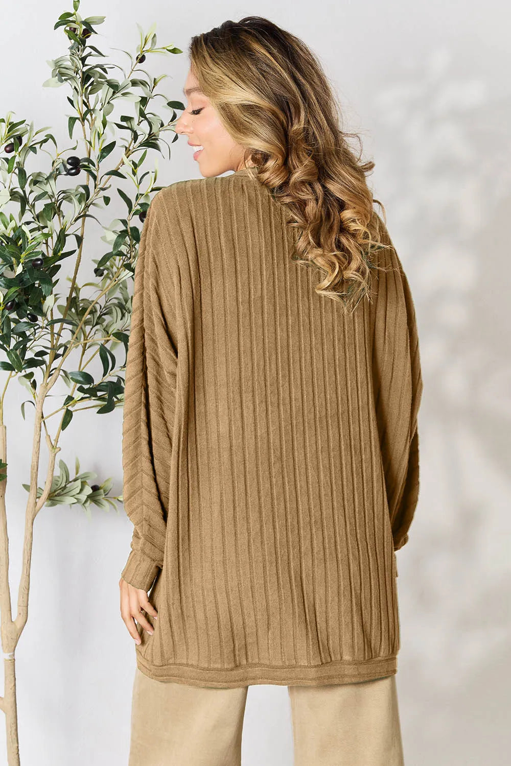 Back view of Basic Bae full size ribbed cocoon cardigan emphasizing flowy shape and cozy feel
