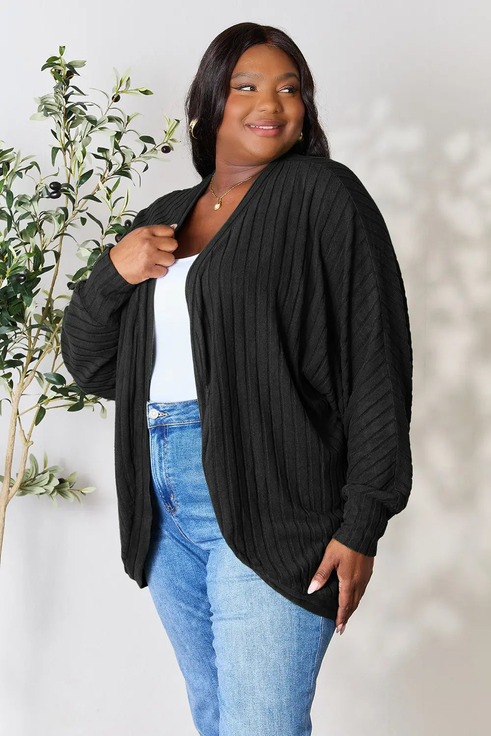 Side view of Basic Bae full size ribbed cocoon cardigan showing draped silhouette and ribbed texture
