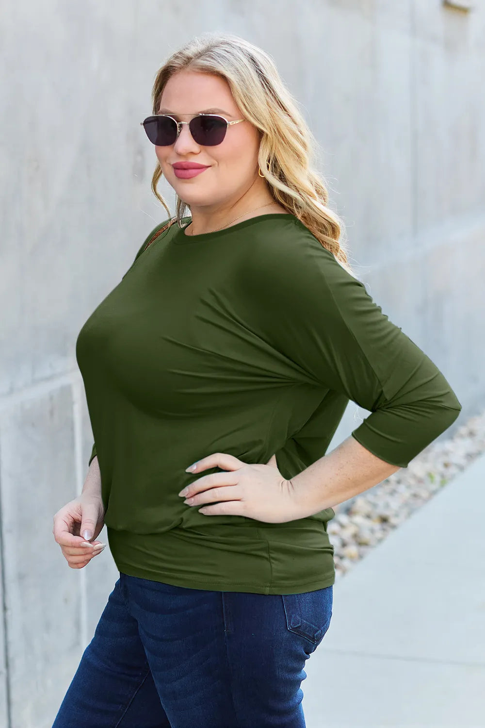 Side style view of Basic Bae full size batwing sleeve top showing roomy fit and casual modern look
