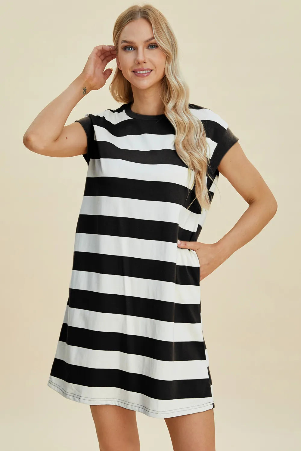 Front view of Basic Bae striped round neck cap sleeve mini dress showing playful lightweight summer design
