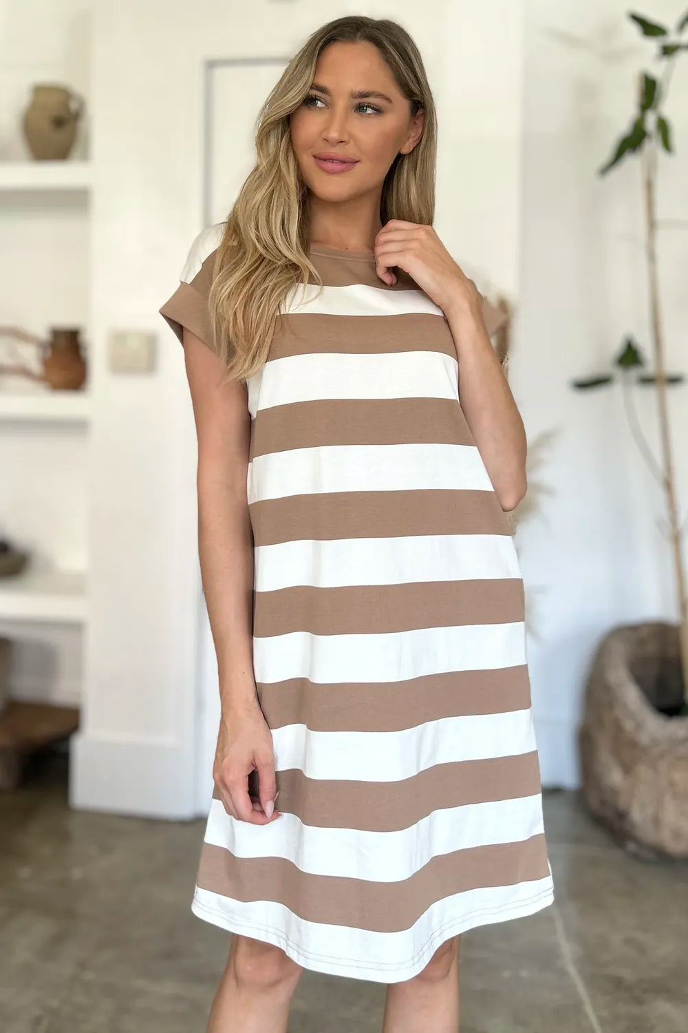 Second front view of Basic Bae striped mini dress highlighting casual fit and flattering short sleeve style
