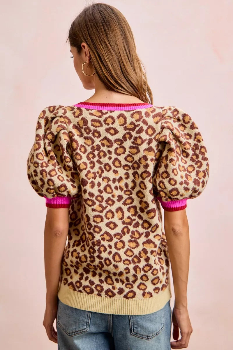 BiBi leopard print puff sleeve V-neck sweater top for women model standing facing back, back view of leopard print top with puff sleeves and V-neck design
