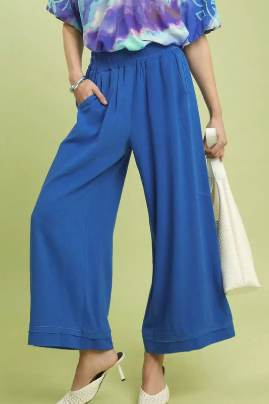 Centprime Umgee linen wide leg pants front view, model standing in sage green elastic waist pants with drawstring and side pockets