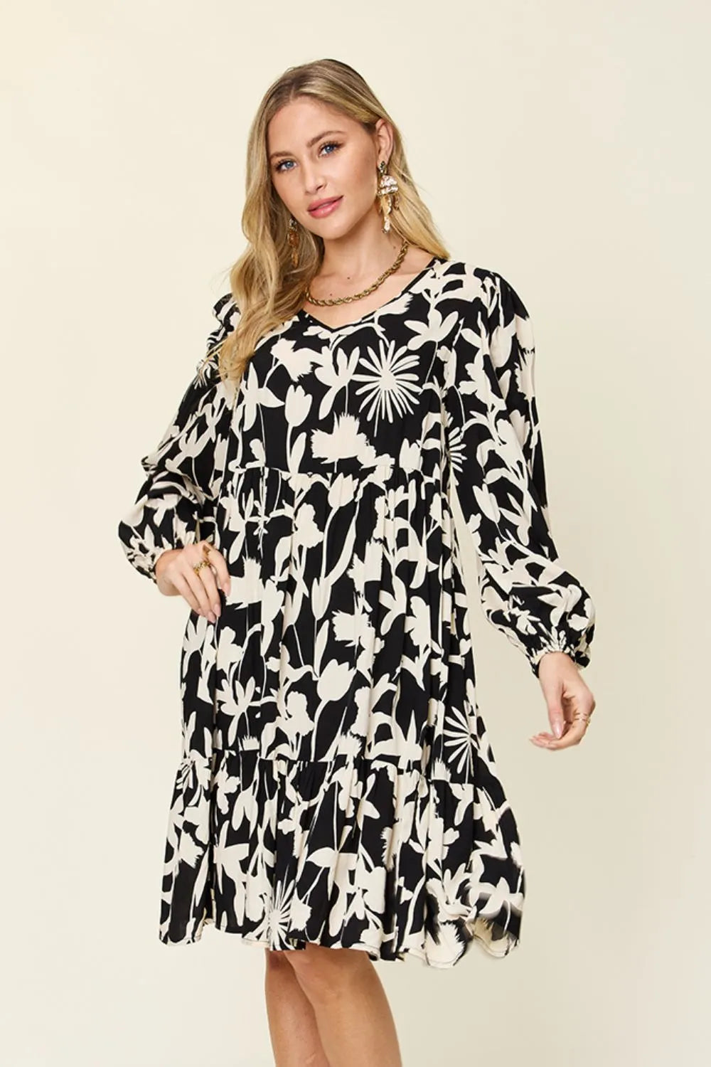 Front style view of Double Take printed ruffle hem dress with pocket designed for everyday comfort
