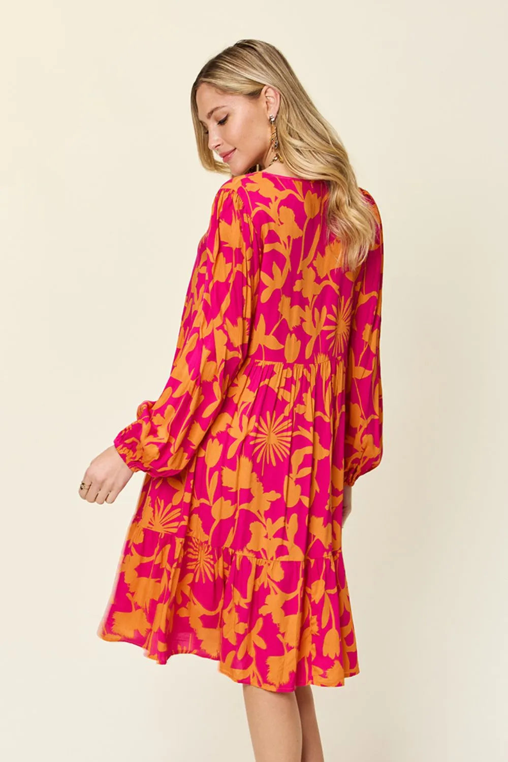 Back view of Double Take full size printed ruffle hem dress emphasizing relaxed silhouette
