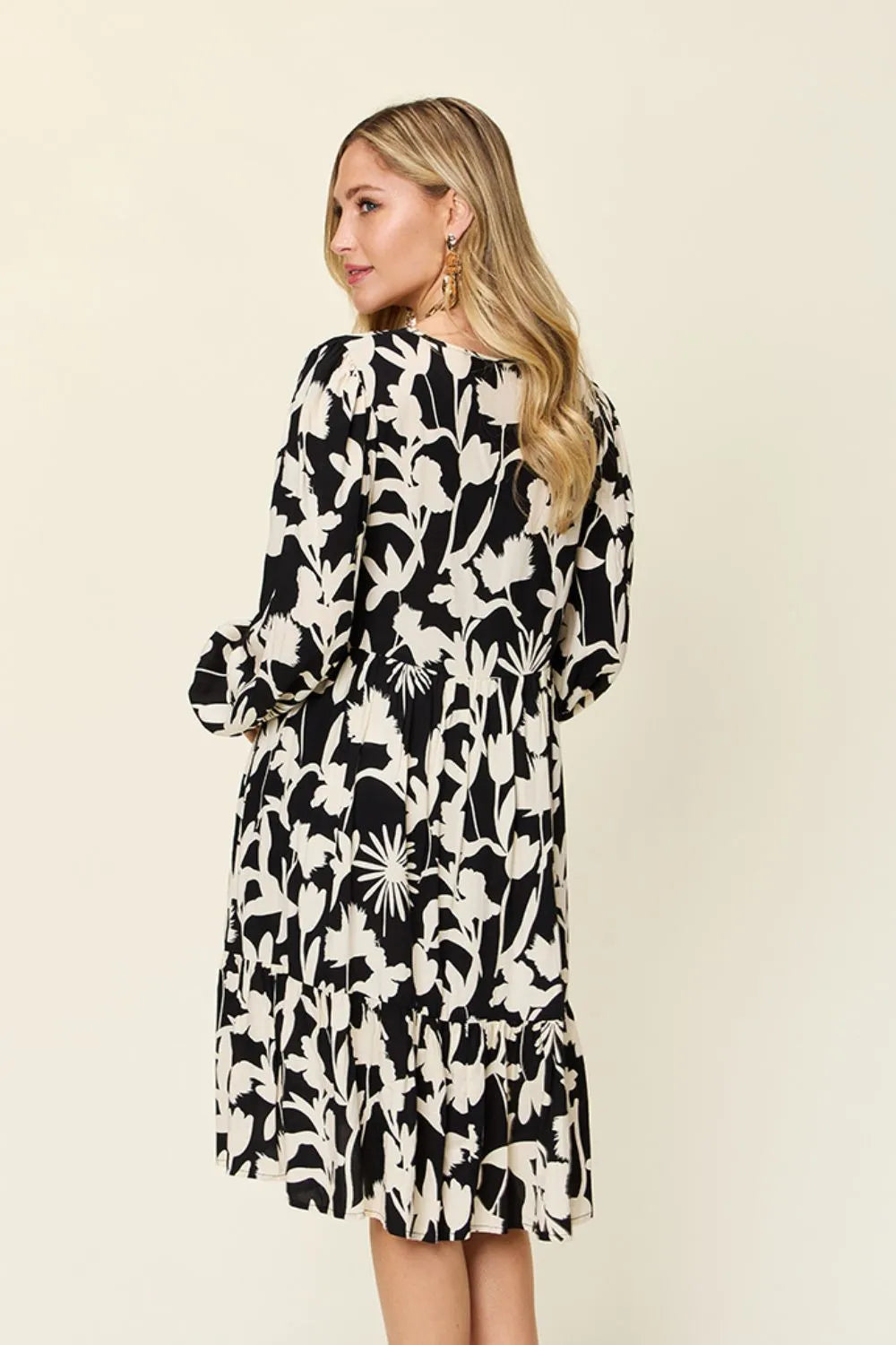 Double Take printed ruffle hem dress back view highlighting flowing fabric and casual style
