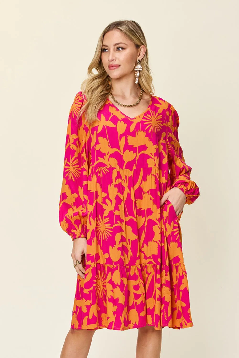 Front style view of Double Take printed ruffle hem dress with pocket designed for everyday comfort
