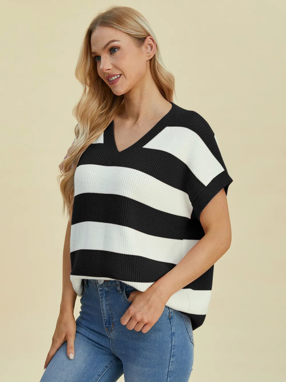 Side view of Double Take Striped V-Neck Short Sleeve Sweater highlighting relaxed silhouette and soft knit fabric