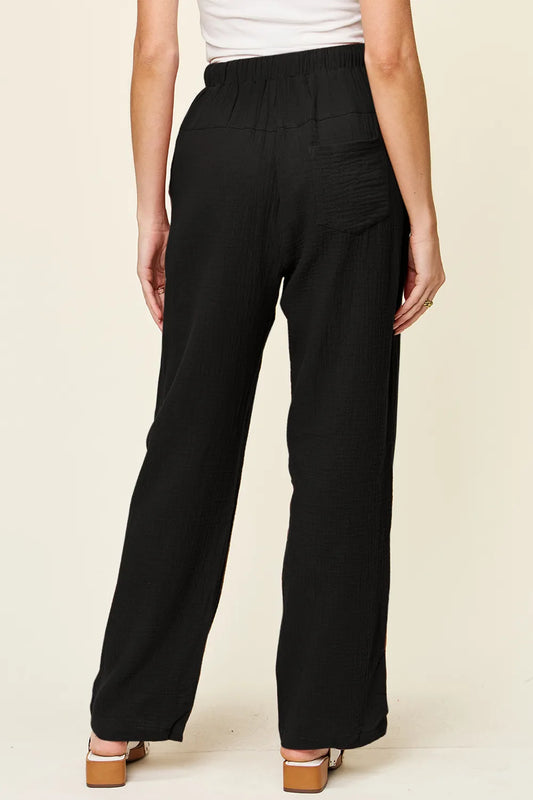 back view of Double Take texture drawstring straight pants showing functional pockets and straight-leg relaxed fit