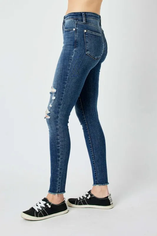 Side angle of Judy Blue full size high waist distressed skinny jeans with distressed detail.
