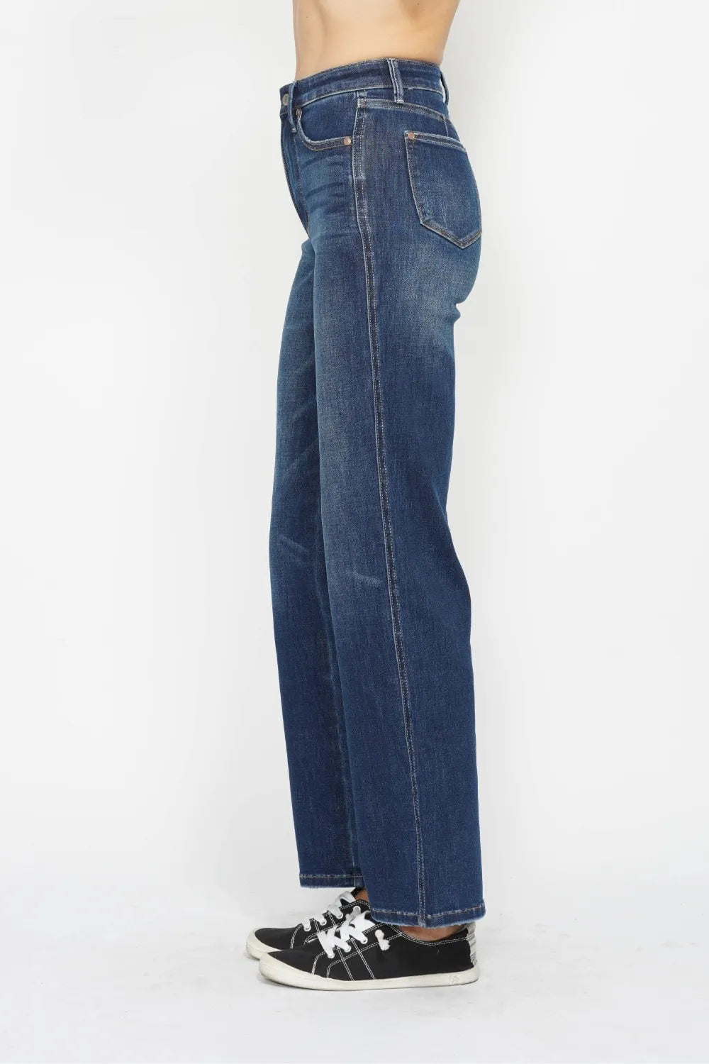Left side view of Judy Blue high waist tummy control jeans. Smoothing panel lies flat. No gaping at waistband.  Flattering fit through thigh. 