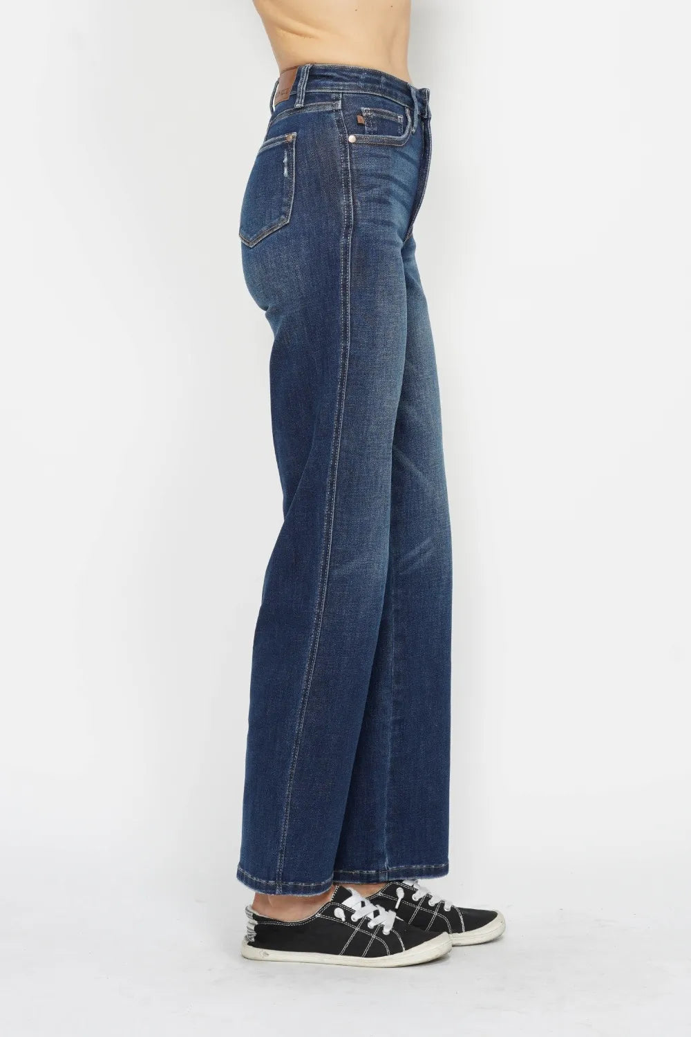Right side view of Judy Blue high waist tummy control jeans. Flat tummy panel visible. No muffin top. Contoured waistband sits higher at back. Moderate stretch denim. Clean silhouette from hip to ankle.