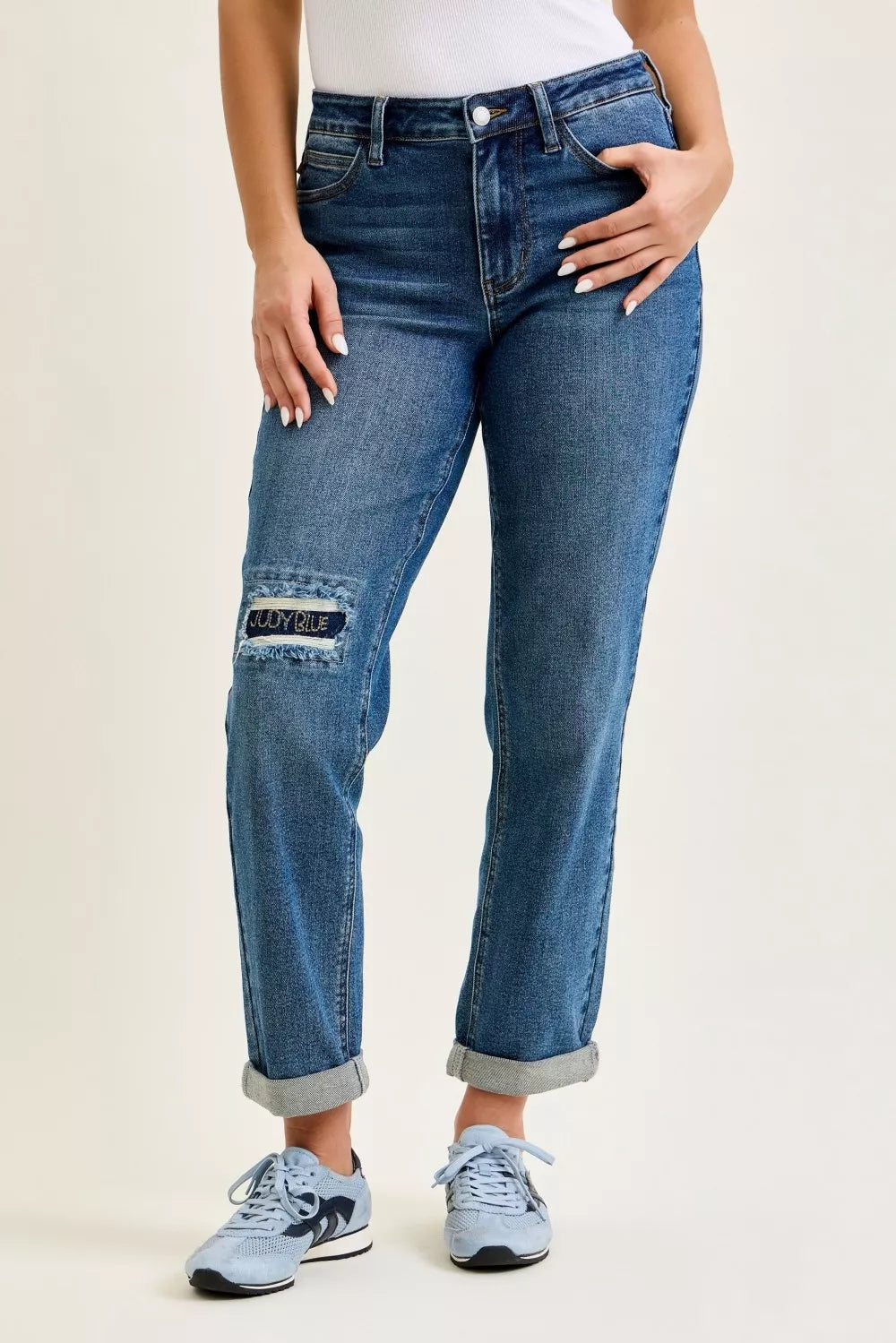 Front view of Judy Blue mid rise boyfriend embroidered repair patch jeans on model
