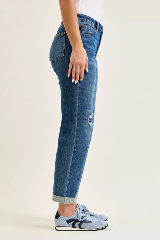Side view of Judy Blue mid rise boyfriend embroidered repair patch jeans showing relaxed fit
