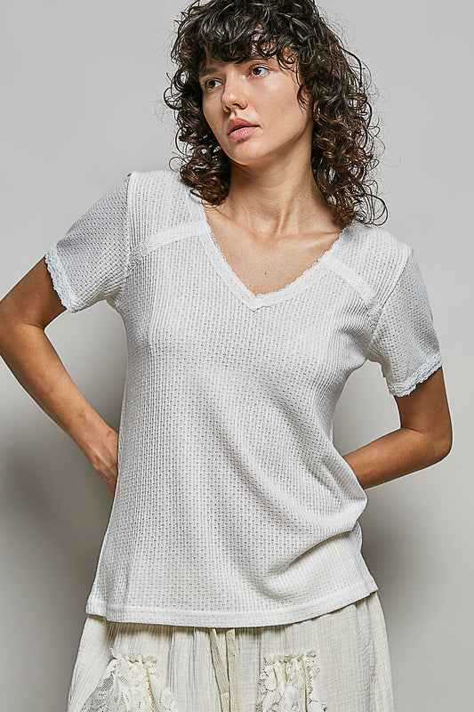 Women's v neck short sleeve textured knit t shirt with delicate lace accents front view featuring regular fit and vintage wash finish