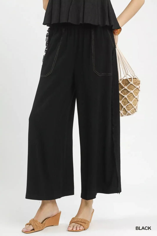 Front view of women's linen frayed side pocket wide leg pants showing relaxed fit and breathable summer design
