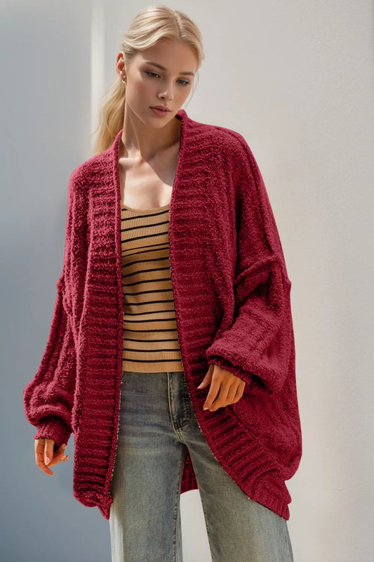 Model wearing open front cardigan standing straight on, long sleeves at wrist, relaxed fit through bust 44.9 inches size S/M, acrylic knit draping open