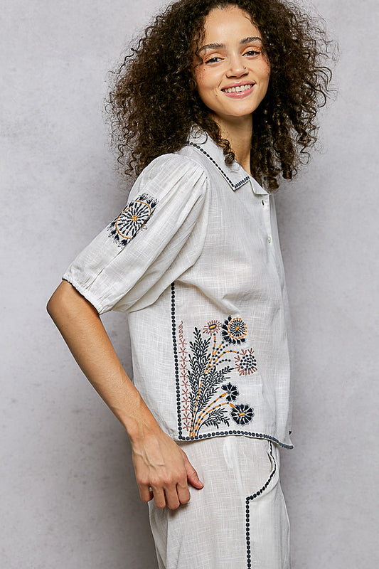Side view of POL short sleeve embroidered floral shirt showing relaxed fit through bust and clean tailored silhouette.
