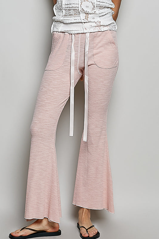 Full front view of POL drawstring textured ribbed knit flare pants with side pockets in relaxed fit.