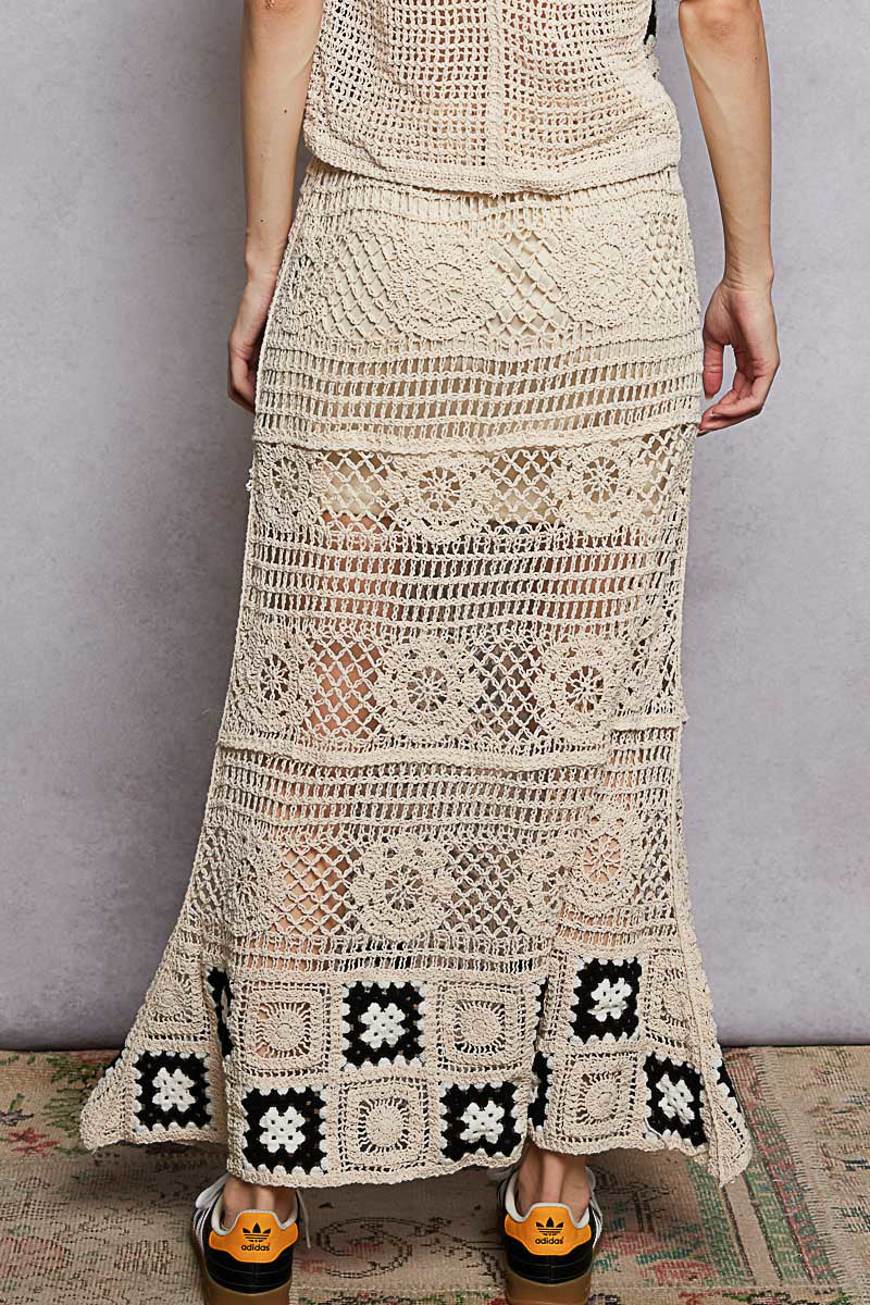 Back view of POL floral crochet maxi skirt. Continuous crochet pattern from waist to hem. Ruffled waistband stretches for easy pull on fit. Maxi length coverage. Layered bohemian beach skirt.