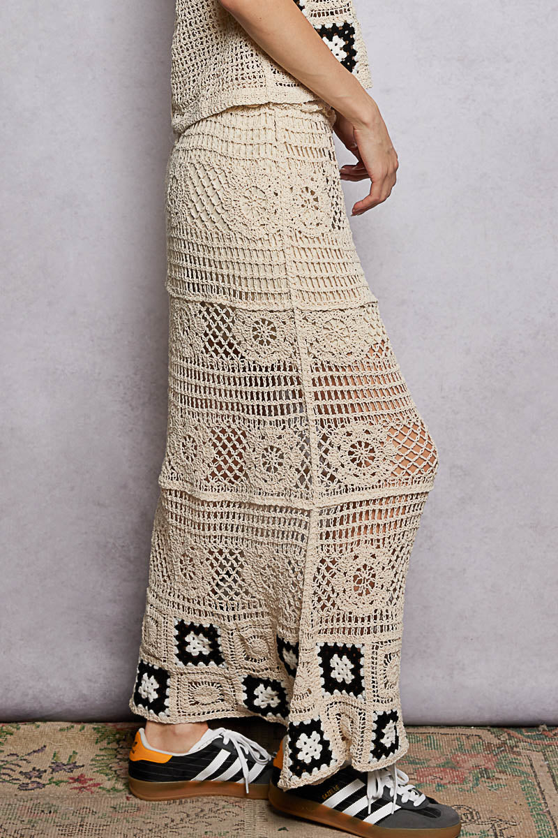 Side view of POL floral crochet maxi skirt. Shows cascading A line silhouette. Ruffled waistband detail at side seam. Crochet stitch texture visible. Sheer open weave. Perfect swimsuit cover up or festival skirt.