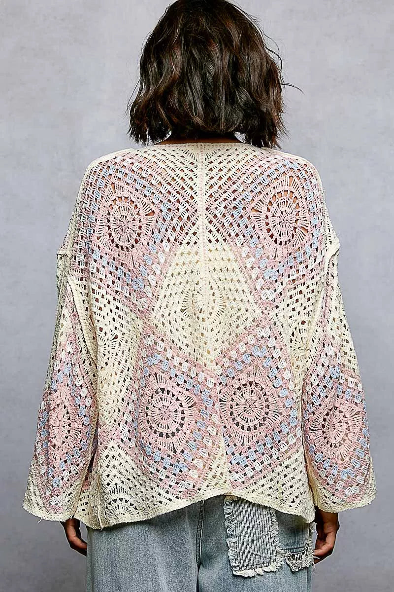 Back view of the POL open front crochet cardigan, displaying the full multicolor granny square pattern across the back.
