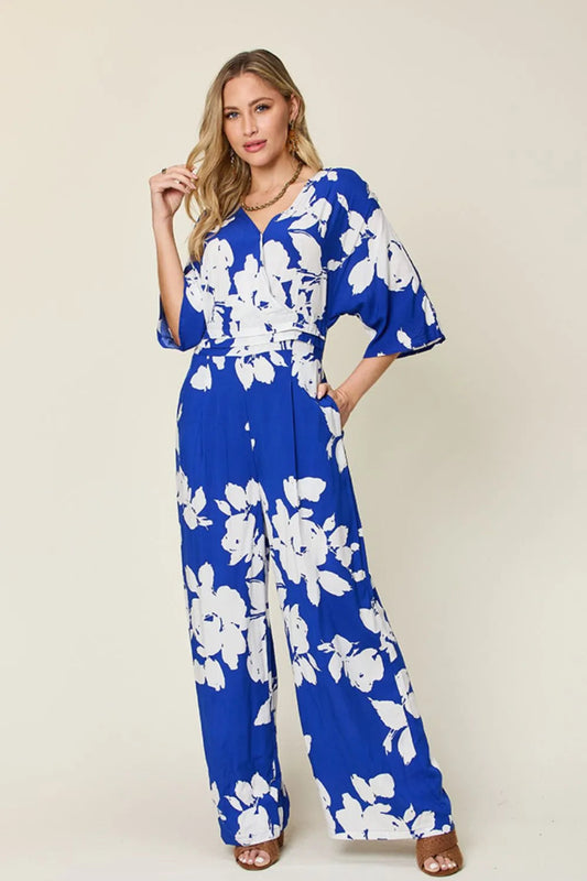 front view of printed tie back wide leg jumpsuit for women showing full length flattering fit and flowy silhouette