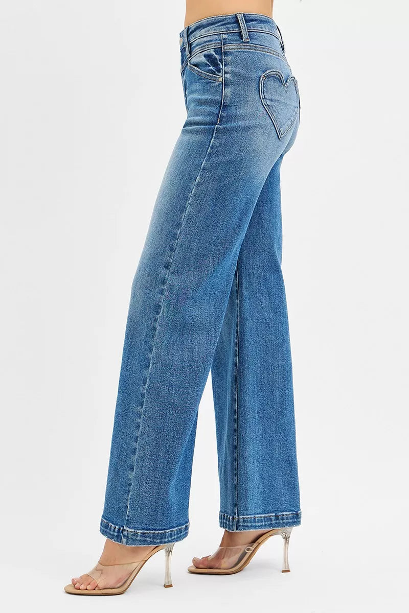 Side view of RISEN high rise wide leg jeans highlighting flattering fit and vintage inspired wide leg cut
