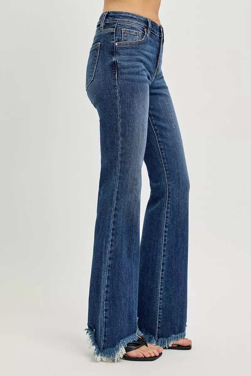 Side view of RISEN full size mid rise flare frayed hem jeans, showing the flare shape and raw hem from the side.
